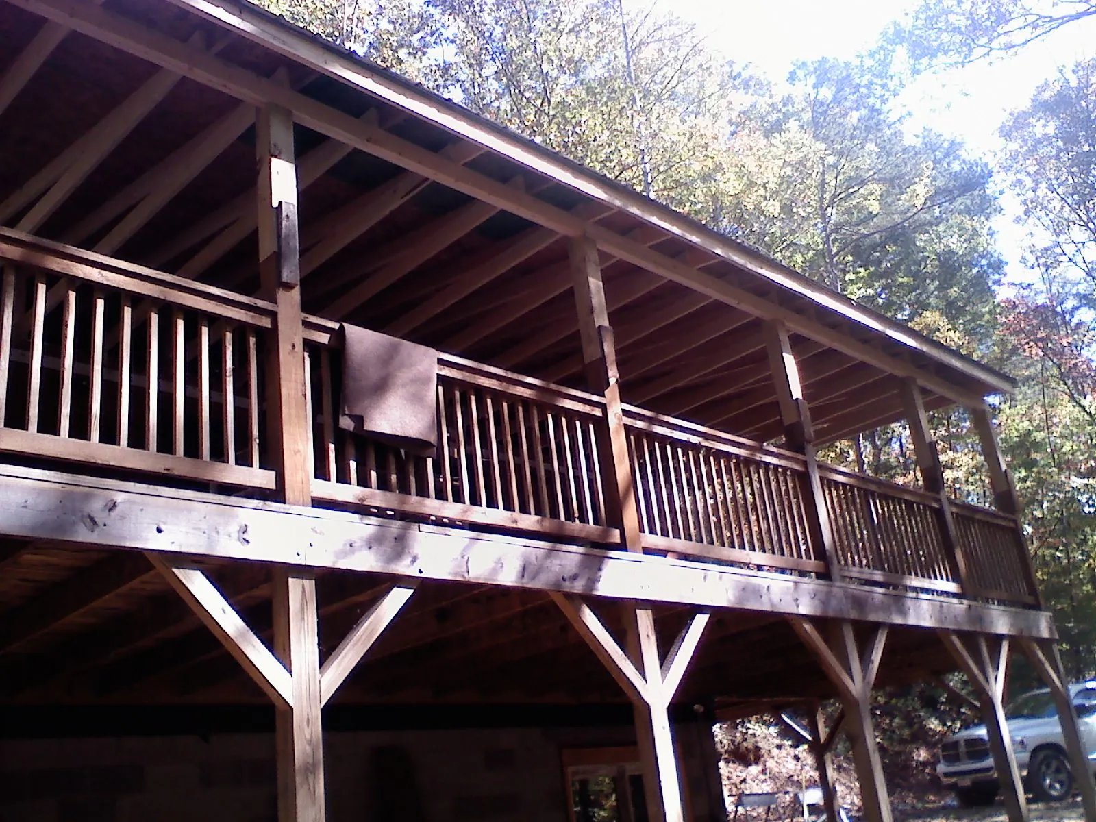 Timber framing under a new elevated porch and deck — Roof Leak Repair in Milan by Roofing Brothers
